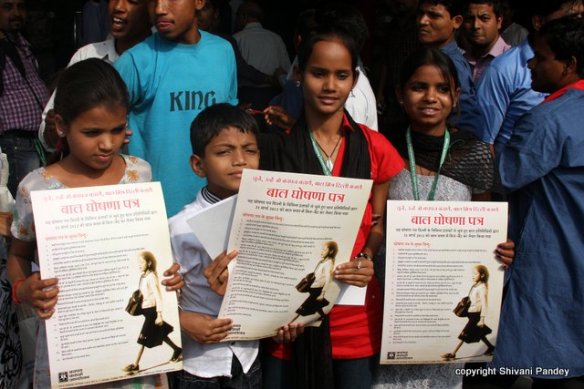 Children with drafted manifesto in their hands