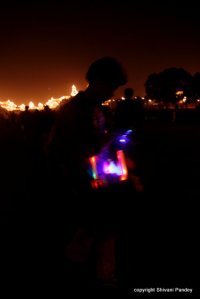 A boy selling a multi colored toy